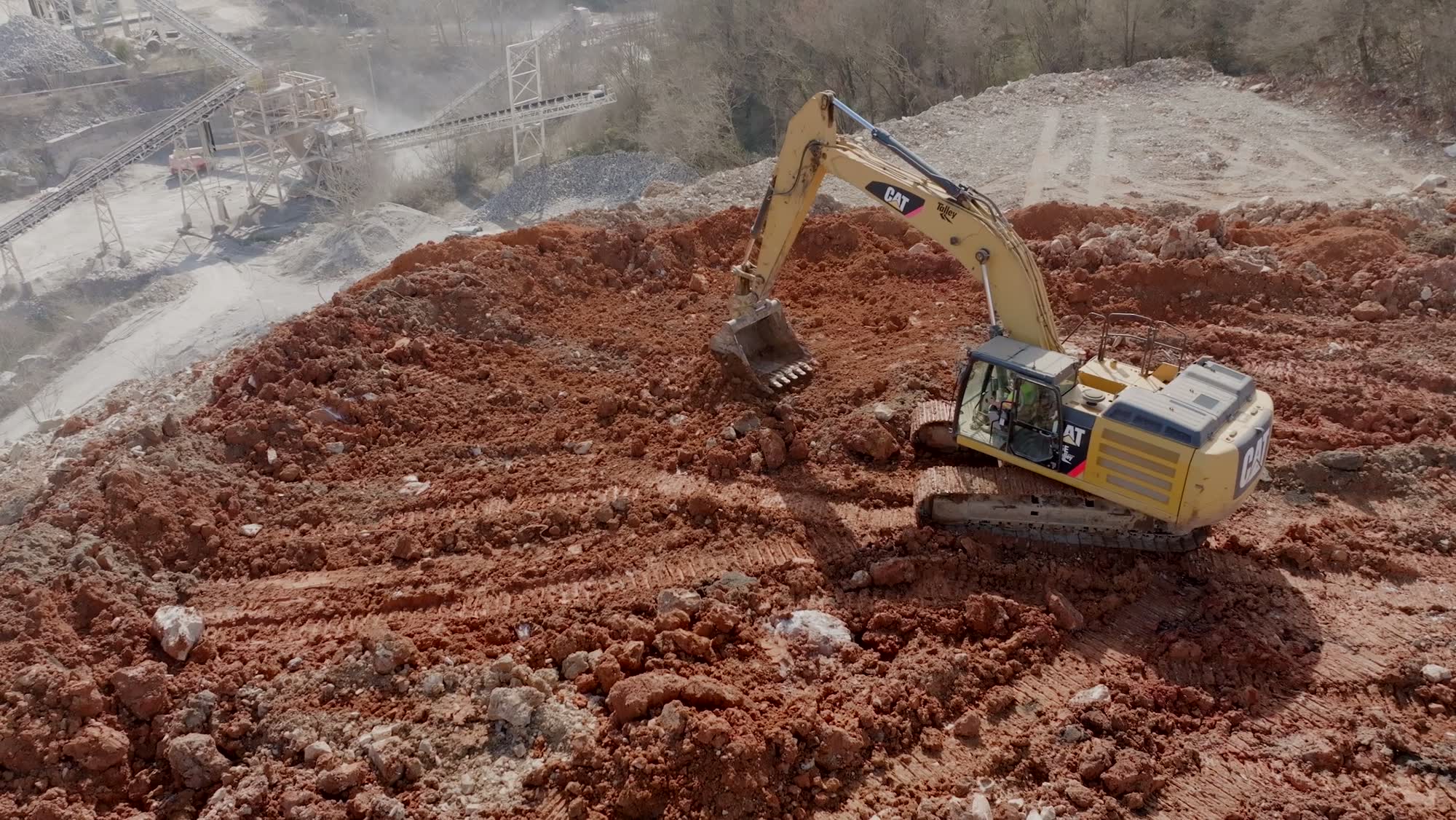 Caterpillar excavator working a large earthwork site